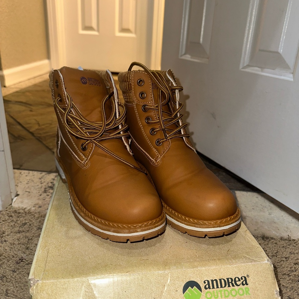 Brown Lace Up Boots with Leather Material and Rugged Design